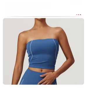 Detailed view of longline sports bra with white slimming stitching and blue high-stretch fabric