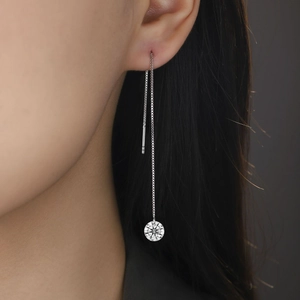 Elegant 925 silver long drop earrings with moissanite zircon on a female model