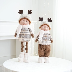 Close-up of knit reindeer plush Christmas figurines with snowflake patterns and faux fur