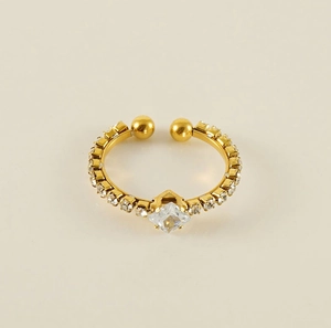 Macro shot of gold adjustable ring with square zircon stone and micro-pave setting