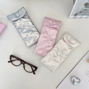 Quilted PU bowknot eyeglass cases in silver, pink, and white with heart buttons