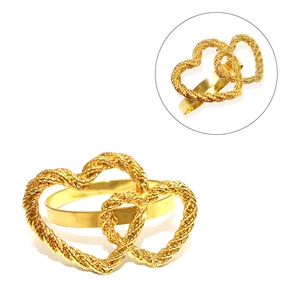 Detail of gold double heart napkin ring with twisted texture and smooth metal surface
