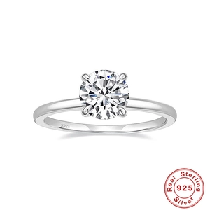 Detailed macro of S925 sterling silver stamp and four-prong solitaire diamond ring setting