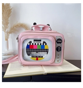 Detailed macro view of the retro TV-shaped pink bag with clear window and colorful signal pattern