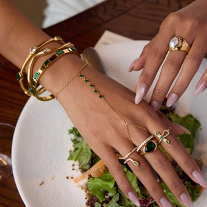 Elegant gold-plated stainless steel jewelry set with green zircon stones and slave bracelet