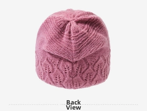 Detailed back view of a pink knitted winter hat showing dense stitch patterns and texture