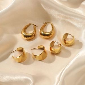 Three-set 14K gold plated geometric stainless steel earrings on elegant silk fabric
