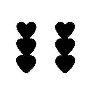Close-up of matte black triple heart drop earrings showing sleek vertical design