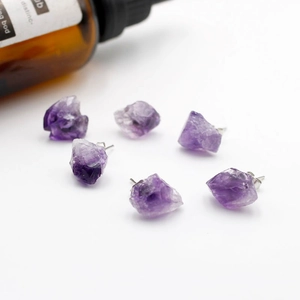 Set of six natural amethyst raw stone stud earrings with unpolished crystal textures