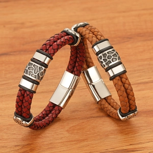 Detail of burgundy and camel braided leather bracelets with stainless magnetic clasps