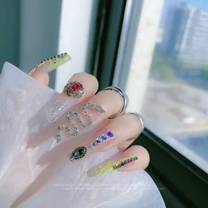 3D snake-shaped nail art jewelry with rhinestones on a model hand, size 3x1.3cm