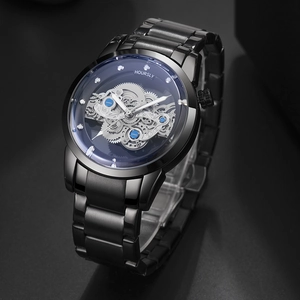 Detail shot of the black steel hollow dial showcasing intricate silver gears and blue accents