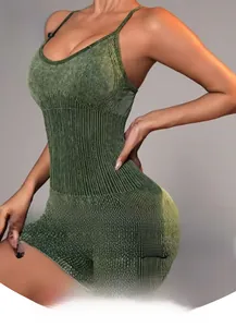 Detail of moss green sand-washed yoga romper with ribbed texture and racerback design