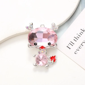 Pink gemstone dragon pendant with inlaid rhinestones on a polished zinc alloy base