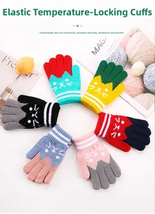 Detail of colorful knit children's winter gloves with cute cartoon cat pattern