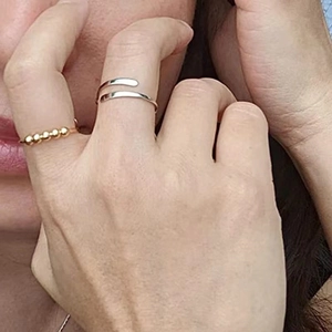 Adjustable anxiety relief ring with rotating beads in gold and silver finish