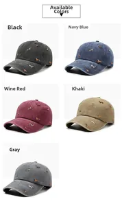 Detailed display of vintage washed cotton baseball caps with embroidered dachshund patterns