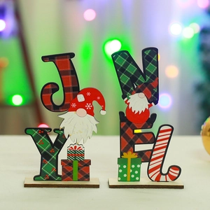 Detailed view of wooden Christmas Joy and Noel letter ornaments with festive gnomes