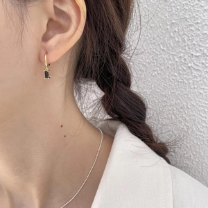 Minimalist 925 silver gold earrings with black rectangular zircon charms on model