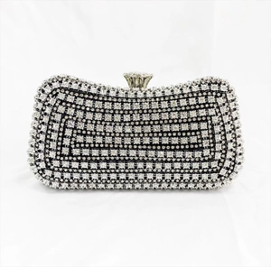 Macro detail of high-quality crystal rhinestones and metal frame on evening clutch bag