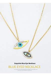 Flat lay of gold and silver devil's eye necklaces with blue enamel and rhinestones