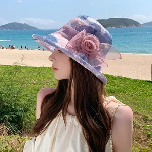 Women's floral summer sun hat with large mesh flower decoration for beach outdoor wear