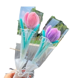 Handmade pink and purple chenille tulip bouquets in LOVE wrap with ribbons