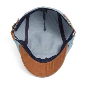 Internal view of blue denim newsboy cap with brown suede brim and cotton lining