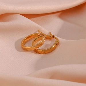 20mm gold plated stainless steel hoop earrings with textured diagonal stripes on silk