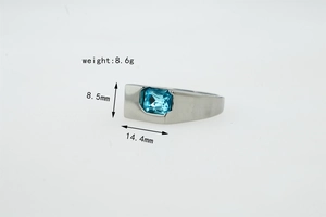 Macro detail of a wide silver ring featuring a large rectangular sky blue zircon stone