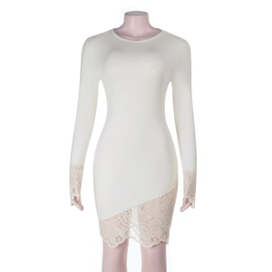 Close-up of knit dress featuring intricate lace sleeves and delicate patchwork hem details