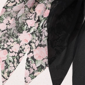 Detail shot of the chiffon floral print fabric showing elegant textures and patterns