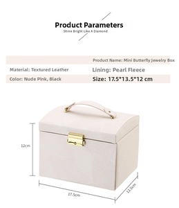 Detail of pink faux leather jewelry box with textured finish and golden metal lock clasp
