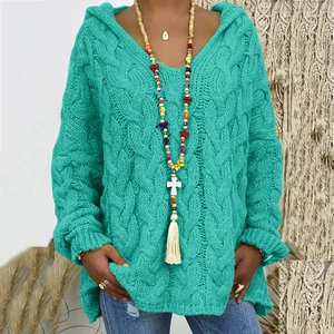 Close-up of vibrant turquoise cable knit hoodie with textured weave and V-neck details