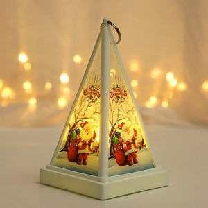 Close-up of white Christmas lantern featuring Santa Claus illustration with warm LED light