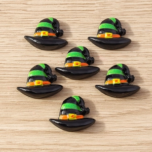 Close-up of resin Halloween wizard hats for DIY crafts on a natural wood surface