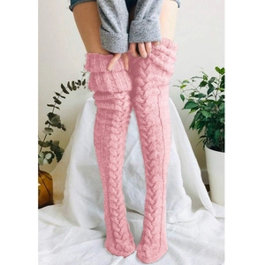 Detail of pink cable knit over-knee leg warmers with textured thick wool pattern