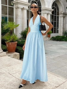 Light blue halter neck cotton maxi dress with V-neck and flowy hem for summer