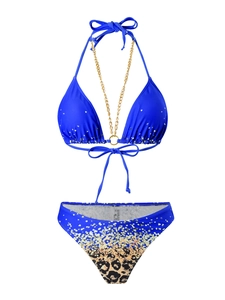 Detail of blue sequined bikini top with gold chain straps and leopard print bottoms