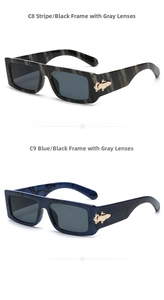 Detail of vintage rectangular sunglasses with gold metal accents and marble texture frames