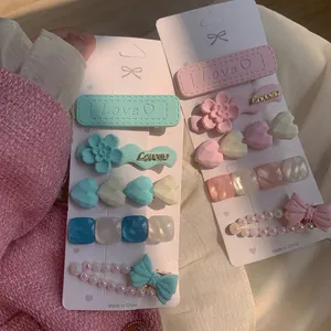 Pastel pink and blue rhinestone pearl hair clip set with floral and love heart motifs