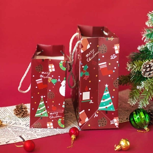 Festive red Merry Christmas paper gift bags with handles, tree and snowman patterns