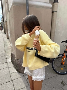 Oversized yellow knit sweater with ESTUDIOS lettering for women's casual street style