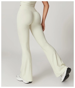 Detail of high-waist cream flared yoga pants with push-up seam and butt-lifting effect