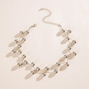 Detailed shot of silver spherical beads with lobster clasp and adjustable extension chain