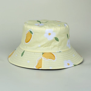 Close-up of yellow bucket hat with floral and mango patterns showing reinforced brim stitching