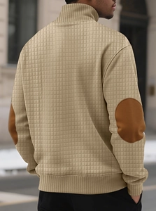 Detail of men's beige waffle knit sweatshirt featuring brown faux leather elbow patches