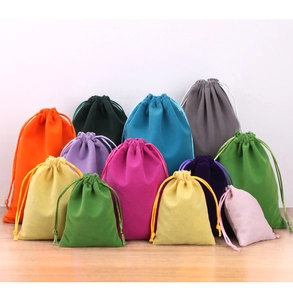 Macro shot of colorful velvet drawstring pouches in various sizes and vibrant shades
