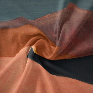 Macro detail of Bohemian tapestry showing sheer fabric texture and abstract color blocks