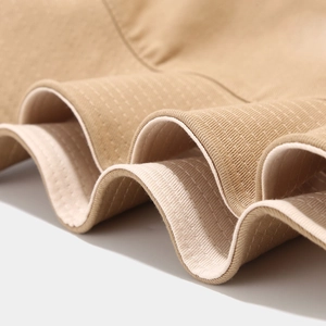 Macro detail of breathable ribbed knit fabric with reinforced stitching for fisherman hat